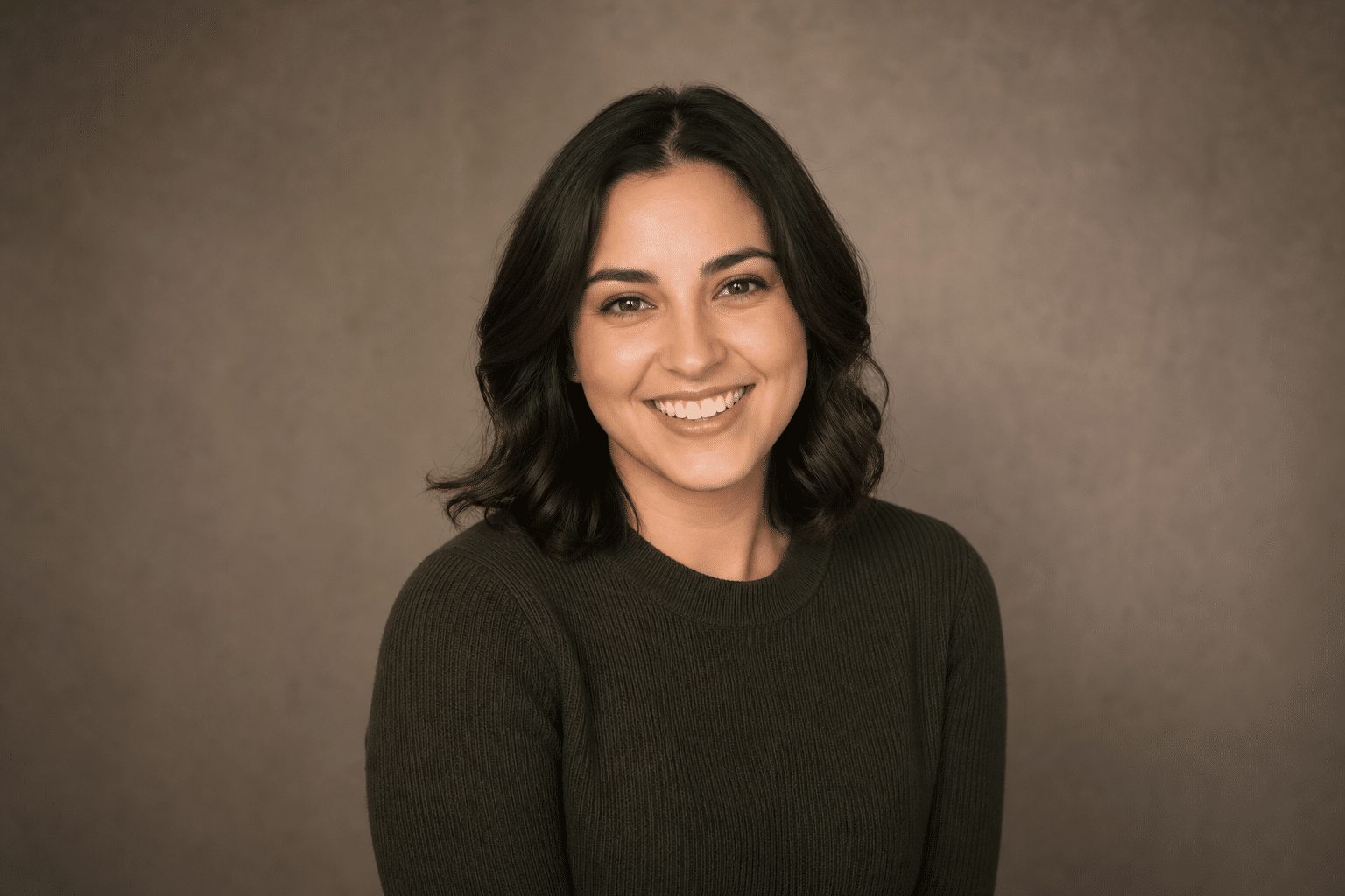 Young actress and creative professional smiling during a studio headshot session at Lightz Out Studios San Diego