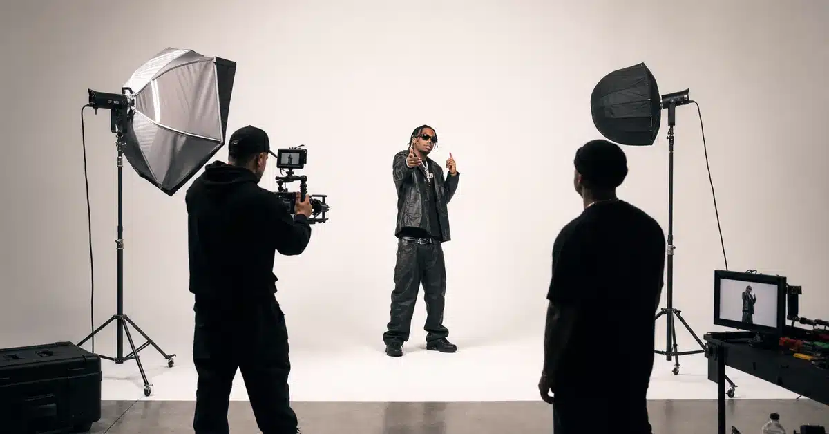 Music video production in San Diego — hip-hop artist performing on white cyclorama backdrop during professional studio shoot