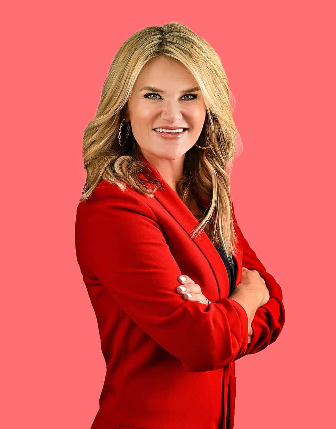 powerful woman in red jacket and salmon background, karen vaisman photography