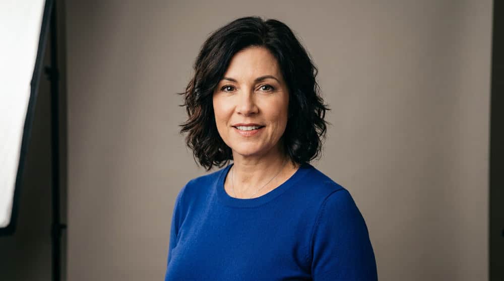 Actress posing for professional headshots for acting in a studio.