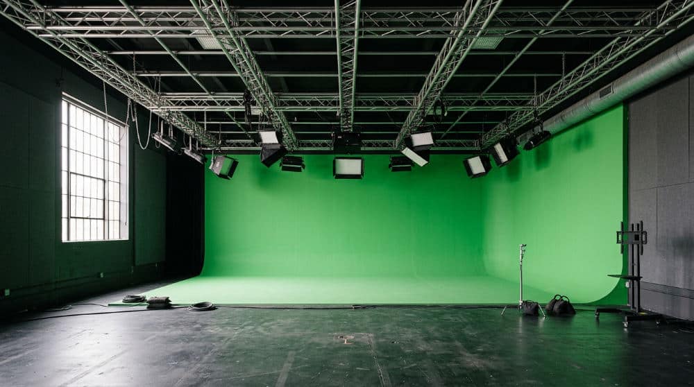 A professional green screen set for video production at a San Diego studio.
