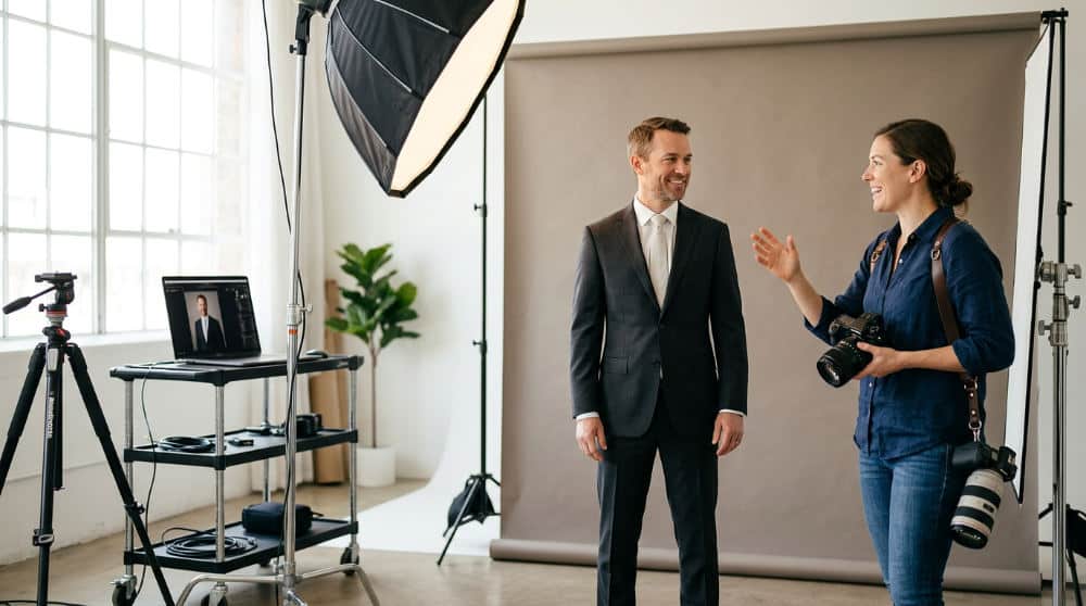 A professional headshot session in a San Diego studio with professional lighting and coaching for a LinkedIn profile update.