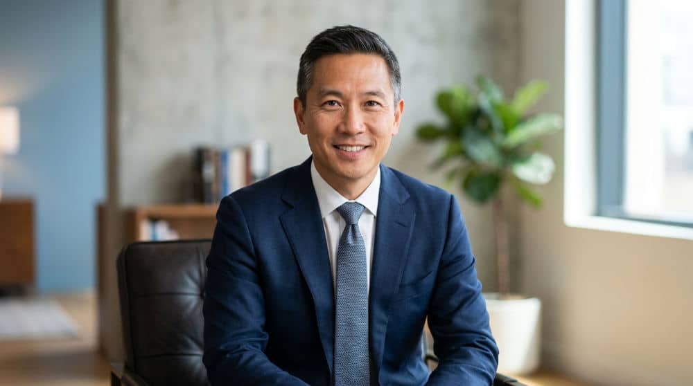 A sharp professional corporate headshot with clean studio lighting.