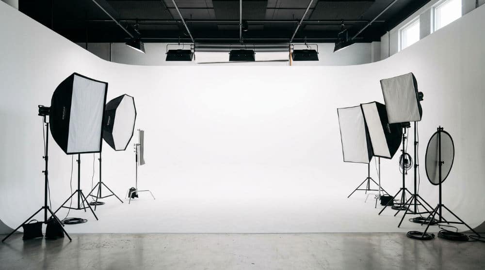 A professional photography cyclorama wall inside a San Diego studio showing a white background.
