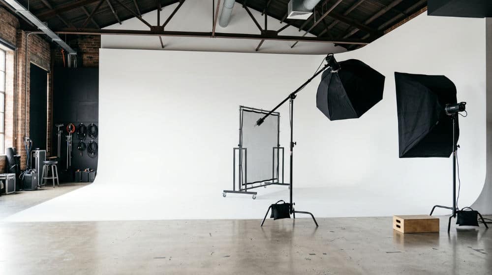 A white photography cyclorama wall in a professional studio setting.