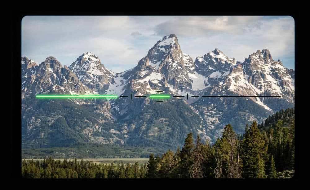 A camera viewfinder showing a digital level for a straight horizon line in photography.