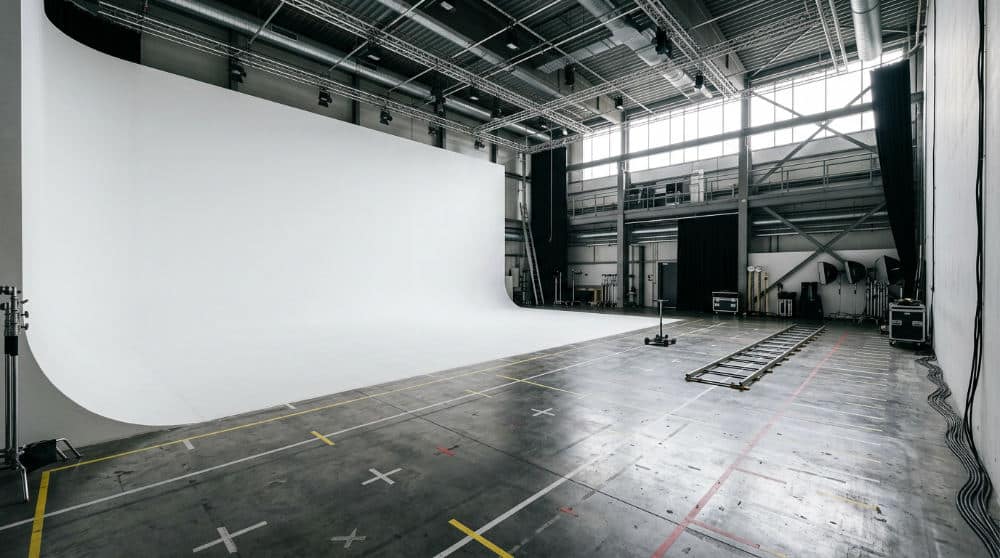 A pristine white cyclorama wall in a San Diego studio facility designed for high-quality video and photo productions.