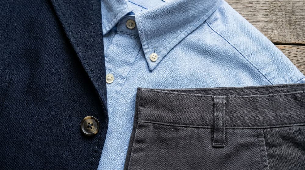 Close-up of professional business casual clothing textures like cotton and wool blends for a professional wardrobe.