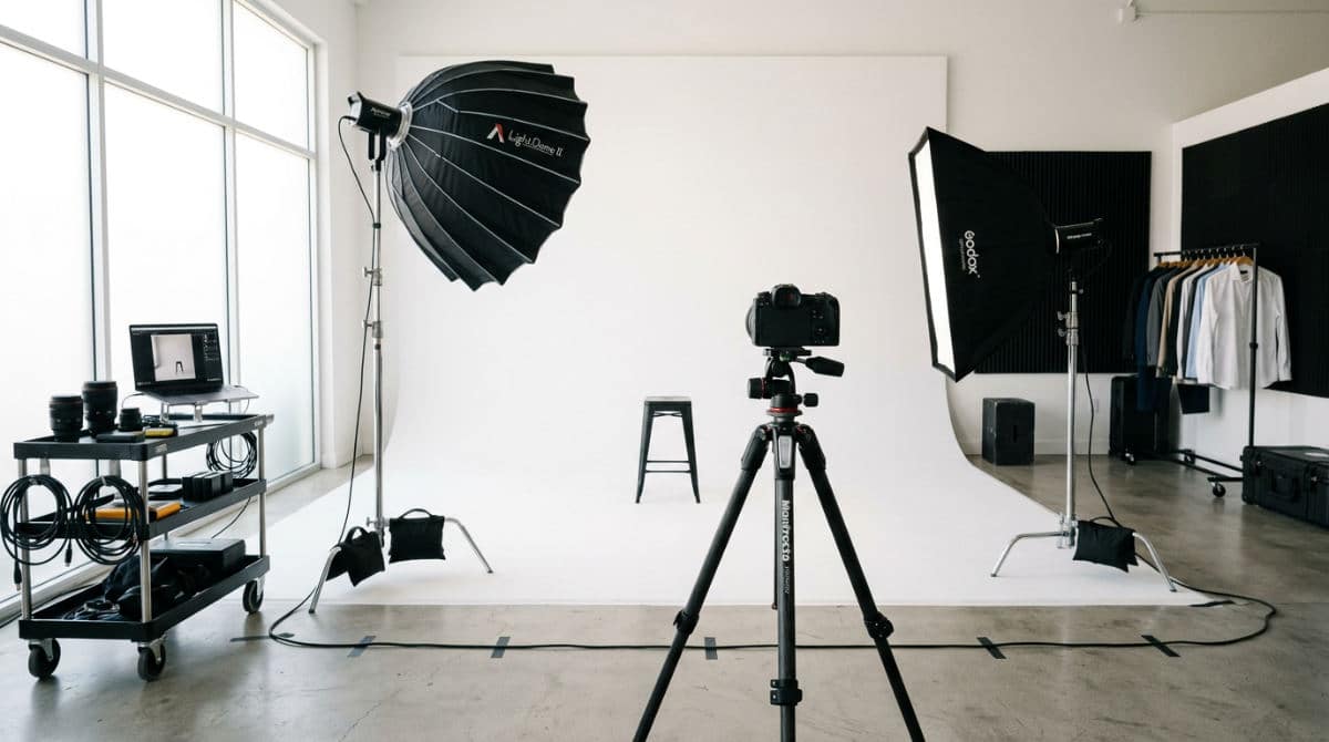 A professional San Diego photography studio equipped with a white cyclorama wall and studio lighting for model headshots.